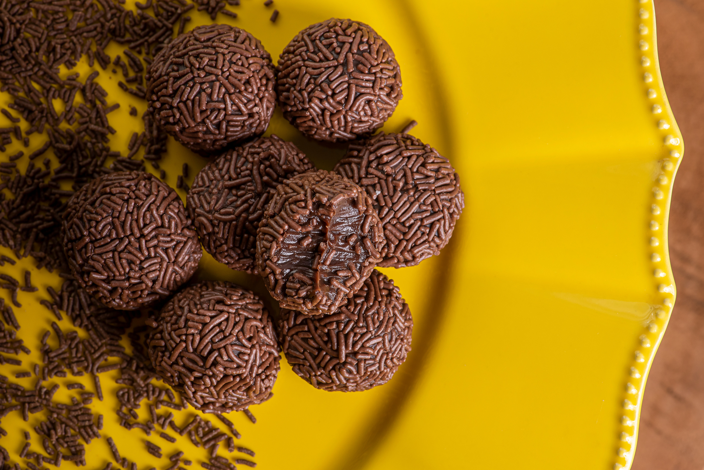 Brigadeiro. Typical Brazilian sweet. Some brigadiers together in a yellow plate